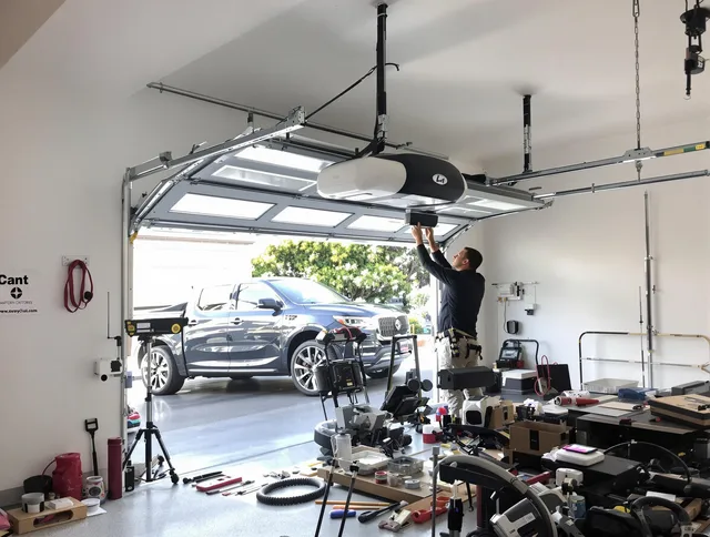 Hinesville Garage Door Repair specialist installing smart garage door opener system in Hinesville home